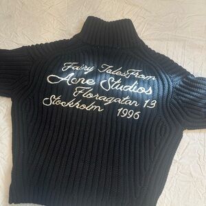 Acne Black Ribbed Turtleneck Sweater with White Script Embroidery